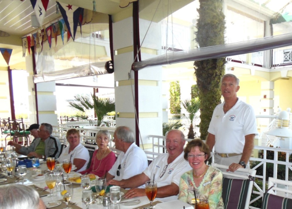 Photo, several adults having lunch in a bright restaurant